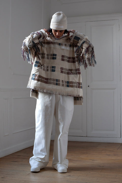 The artisanal fringe hoody is a mix of tweed fabrics from luxury houses deadstock. This unique piece is made locally in Paris to reduce environmental impact and guarantee high quality and durability of the products. It is gender neutral, has oversize fit and has a minimal impact on environment.