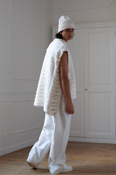 The artisanal sleeveless sweater is a mix of tweed fabrics from luxury houses deadstock. This unique piece is made locally in Paris to reduce environmental impact and guarantee high quality and durability of the products. It is gender neutral, has oversize fit and has a minimal impact on environment.
