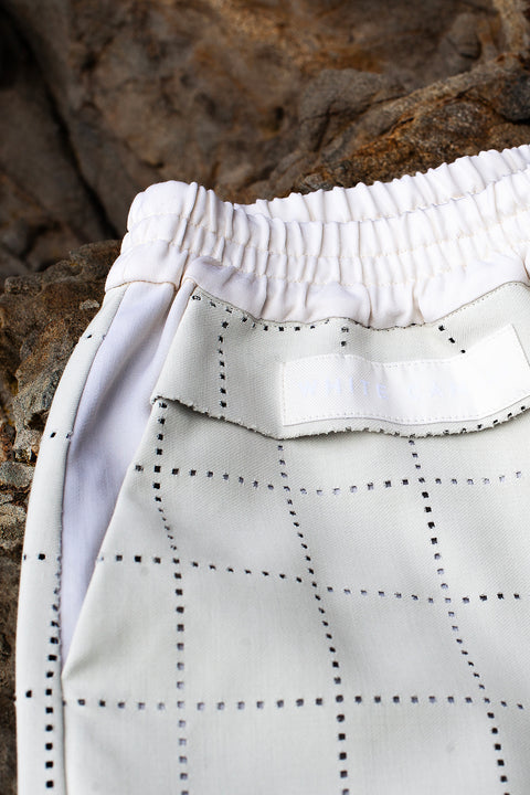 White Canvas sustainable light grey color, genderless, seasonless casual checks trousers, size S. The Essential checks trousers have minimal modern aesthetics design allowing comfort and bringing self-confidence. This unique piece is made locally in Paris to reduce environmental impact and guarantee high quality and durability of the products.