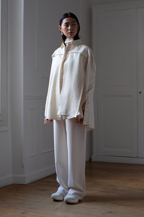 SiJia is wearing the White Canvas essentails wool trousers and organic cotton oversized gender neutral shirt styled with the checks tweed vertical fabric panel made from leftover deadstock fabrics. The tweed panel is an exclusive unique sustainable piece made in France. It is made to be attached to the essential pieces to personalize them and wear them your unique way.