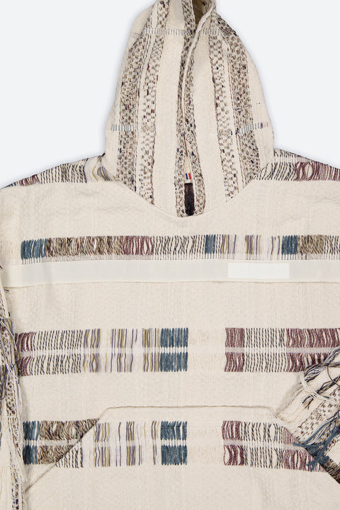 The artisanal fringe hoody is a mix of tweed fabrics from luxury houses deadstock. This unique piece is made locally in Paris to reduce environmental impact and guarantee high quality and durability of the products. It is gender neutral, has oversize fit and has a minimal impact on environment.