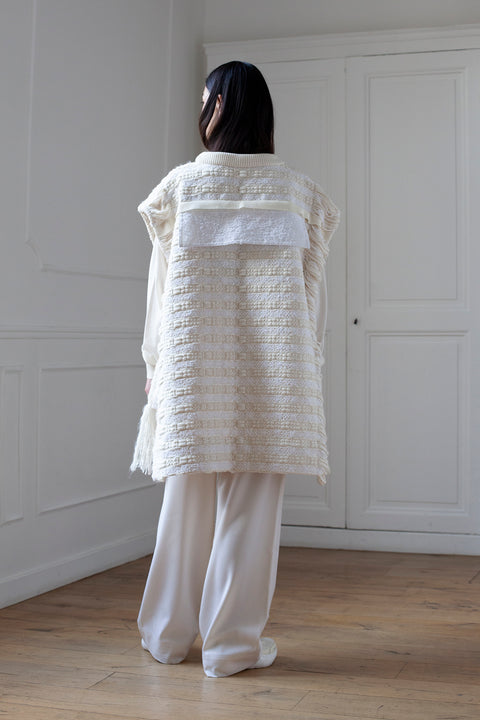 The artisanal sleeveless sweater is a mix of tweed fabrics from luxury houses deadstock. This unique piece is made locally in Paris to reduce environmental impact and guarantee high quality and durability of the products. It is gender neutral, has oversize fit and has a minimal impact on environment.