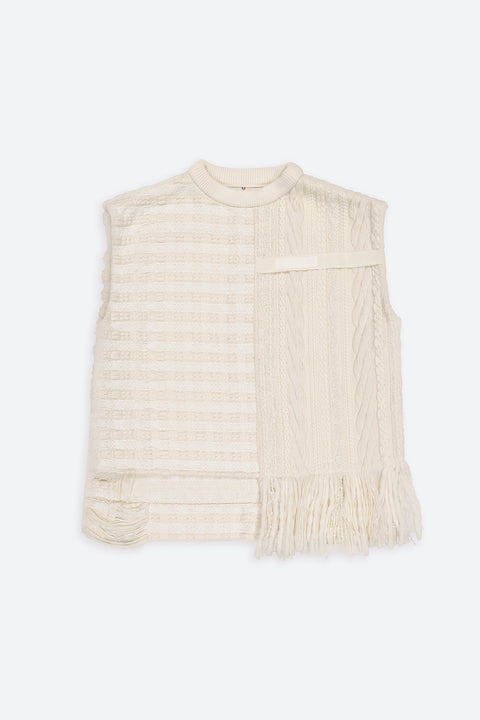 The artisanal sleeveless sweater is a mix of tweed fabrics from luxury houses deadstock. This unique piece is made locally in Paris to reduce environmental impact and guarantee high quality and durability of the products. It is gender neutral, has oversize fit and has a minimal impact on environment.