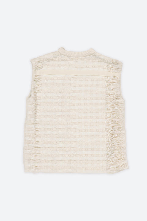 The artisanal sleeveless sweater is a mix of tweed fabrics from luxury houses deadstock. This unique piece is made locally in Paris to reduce environmental impact and guarantee high quality and durability of the products. It is gender neutral, has oversize fit and has a minimal impact on environment.