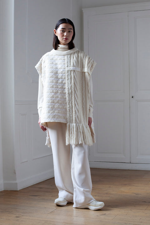 The artisanal sleeveless sweater is a mix of tweed fabrics from luxury houses deadstock. This unique piece is made locally in Paris to reduce environmental impact and guarantee high quality and durability of the products. It is gender neutral, has oversize fit and has a minimal impact on environment.