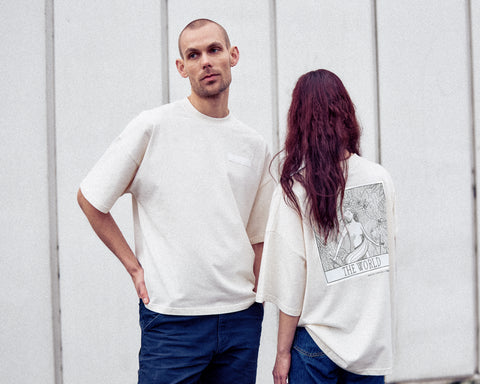 The two models are wearing the White Canvas Originals sustainable, oversized, genderless t-shirt, one size. The organic cotton natural color t-shirt has minimal modern aesthetics design allowing comfort and bringing self-confidence. This limited edition collection is made in Portugal to reduce environmental impact and guarantee high quality and durability of the products.