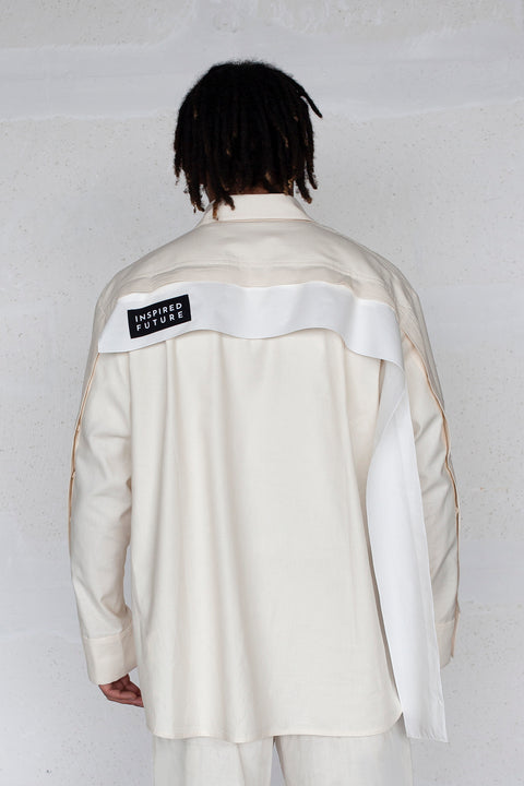 The White Canvas ESSENTIAL SHIRT with white cotton poplin fabric panel made from leftover deadstock fabrics and with black patch and artisanal eco-friendly screen print done locally in Paris in collaboration with RoStudio. Attach the panel to the essential pieces to personalize them and wear them your unique way