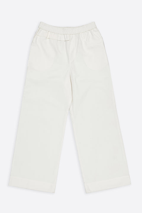 The white cotton textured trousers have minimal modern aesthetics design allowing comfort and bringing self-confidence. This unique piece is made locally in Paris to reduce environmental impact and guarantee high quality and durability of the products.