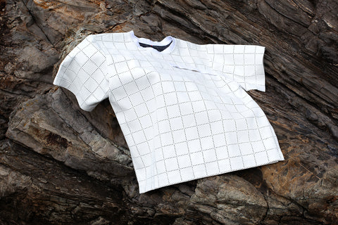 White Canvas sustainable light grey color, oversized, genderless, seasonless casual checks t-shirt, one size. The Essential checks t-shirt has minimal modern aesthetics design allowing comfort and bringing self-confidence. This unique piece is made locally in Paris to reduce environmental impact and guarantee high quality and durability of the products. 