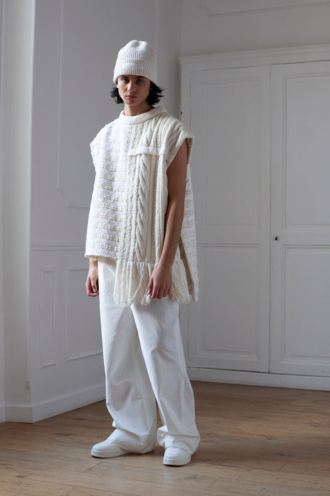 The artisanal sleeveless sweater is a mix of tweed fabrics from luxury houses deadstock. This unique piece is made locally in Paris to reduce environmental impact and guarantee high quality and durability of the products. It is gender neutral, has oversize fit and has a minimal impact on environment. 