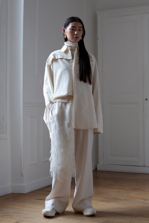 SiJia is wearing the White Canvas essentails loose fit wool trousers with a Zero Waste fabric panel