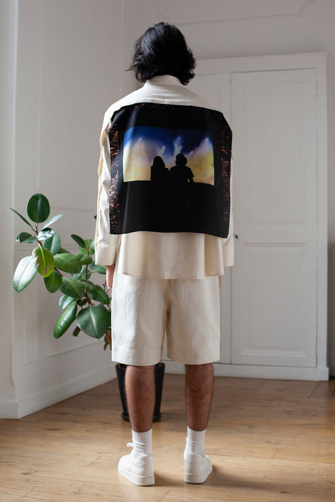 Medhi is wearing the White Canvas ESSENTIAL SHIRT styled with the Shadows foulard and square panel made from a qualitative silk fabric. The foulard is printed in France with an exclusive photo by the photographer Henrique Soares. Wear the foulard alone or attach it to the essential pieces to personalize them and wear them your unique way. Your perfect summer accessory. White Canvas x Henrique Soares creative collaboration.