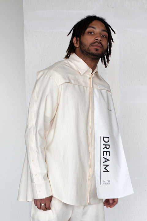 The White Canvas ESSENTIAL SHIRT with white cotton poplin fabric panel made from leftover deadstock fabrics and with black artisanal eco-friendly screen print done locally in Paris in collaboration with RoStudio. Attach the panel to the essential pieces to personalize them and wear them your unique way