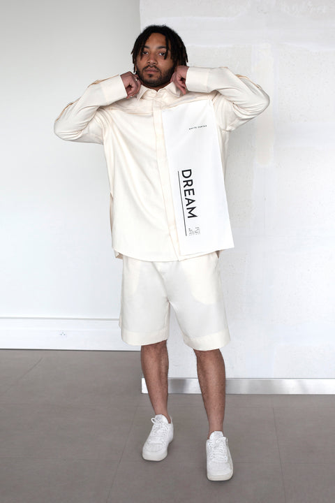 The White Canvas ESSENTIAL SHIRT with white cotton poplin fabric panel made from leftover deadstock fabrics and with black artisanal eco-friendly screen print done locally in Paris in collaboration with RoStudio. Attach the panel to the essential pieces to personalize them and wear them your unique way