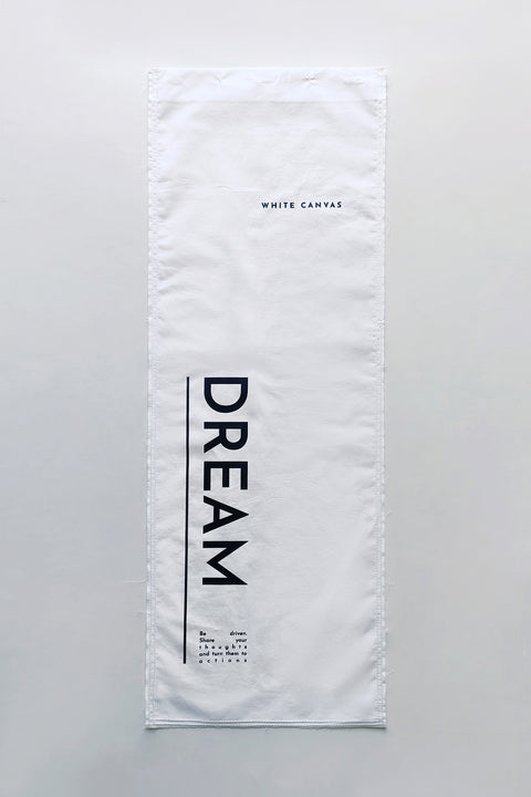 The White Canvas ESSENTIAL SHIRT with white cotton poplin fabric panel made from leftover deadstock fabrics and with black artisanal eco-friendly screen print done locally in Paris in collaboration with RoStudio. Attach the panel to the essential pieces to personalize them and wear them your unique way