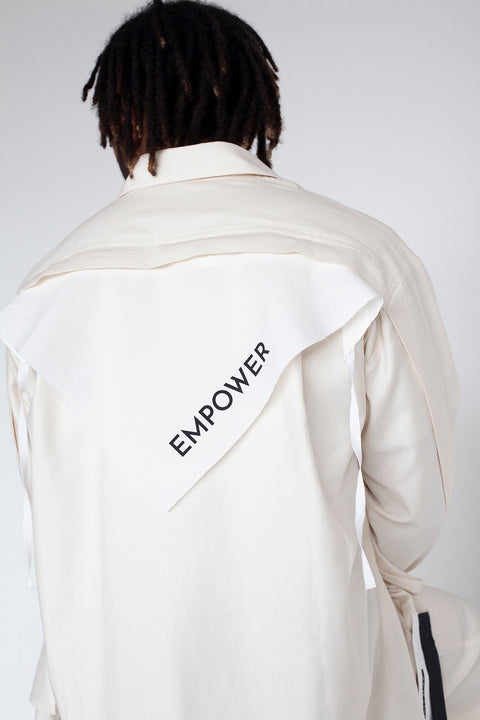 The White Canvas ESSENTIAL SHIRT with white cotton poplin fabric panel made from leftover deadstock fabrics and with black artisanal eco-friendly screen print done locally in Paris in collaboration with RoStudio. Attach the panel to the essential pieces to personalize them and wear them your unique way