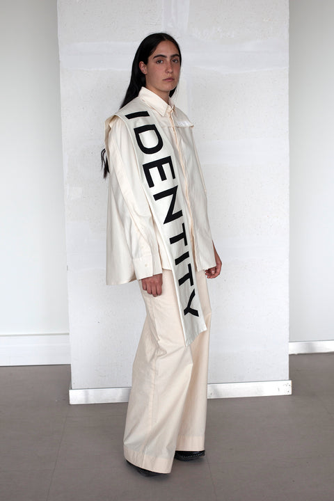 The White Canvas scarf in natural cotton color made from leftover deadstock fabrics and with black patched IDENTITY letters. Unique piece, made in France