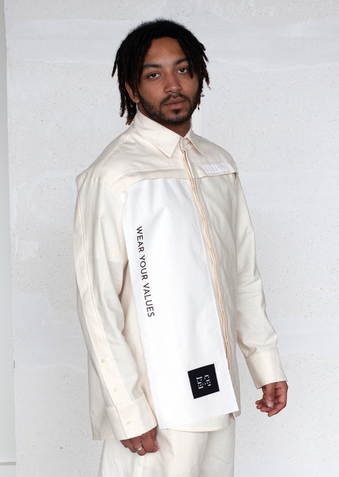 The White Canvas ESSENTIAL SHIRT with white cotton poplin fabric panel made from leftover deadstock fabrics and with black patch and artisanal eco-friendly screen print done locally in Paris in collaboration with RoStudio. Attach the panel to the essential pieces to personalize them and wear them your unique way